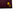 Close up of the Triptych company logo, in gold foil on a dark red background. Logo features two interlocking squares.